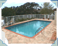 Fran & Allan's lovely pool complex in St Heliers. 14 x 29 Jupiter model Rectangle. Reno Blue interior, Terracotta Copings