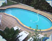"RIO" model pool, Aqua Blue with Heritage "Sabre" pool copings and Turquoise walk-out steps