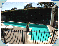 Side view of 2,4 x 9,6 (8' x 32') swimlane pool in St Heliers Bay. The walkout area and play area is for the kids - while Dad exercises by swimming lengths