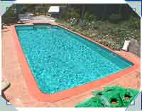 Lovely Low Maintenance 12x24 pool on what was a steep - and unused - sloping piece of ground. Retaining walls turned this area into a fabulous entertaining area!