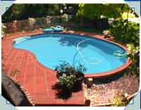 Same Pool from the retaining wall end. They plan to add decking where you can see a pebble garden at present. This will increase the pool area by 12 square meters, making what was an un-used area even more suitable for a modern life-style!