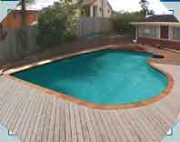 Same Pool. Different Angle. Has wide play platform next to deep end. the kids love it!