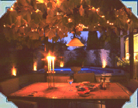 How would you like this setting for dinner? Lots of luck Kiwis do - dining by their CASCADE swimming pool!